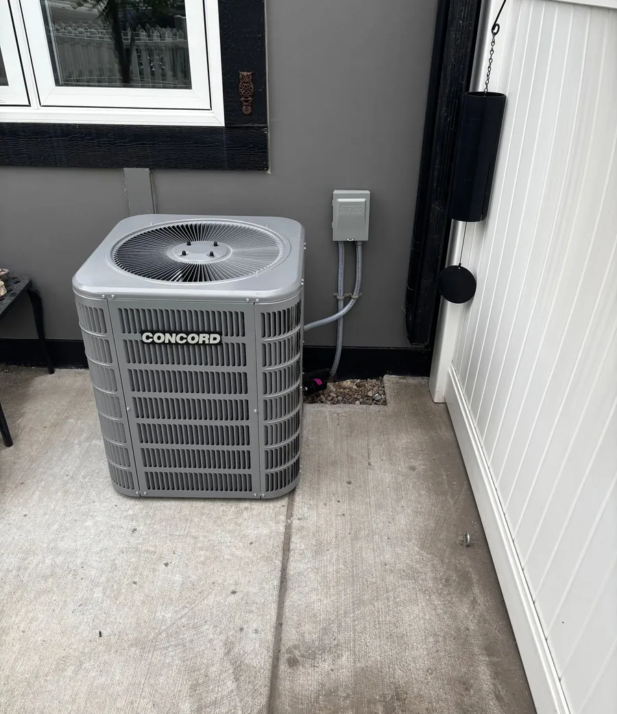 Concord central air conditioning condenser outside a Saskatoon home