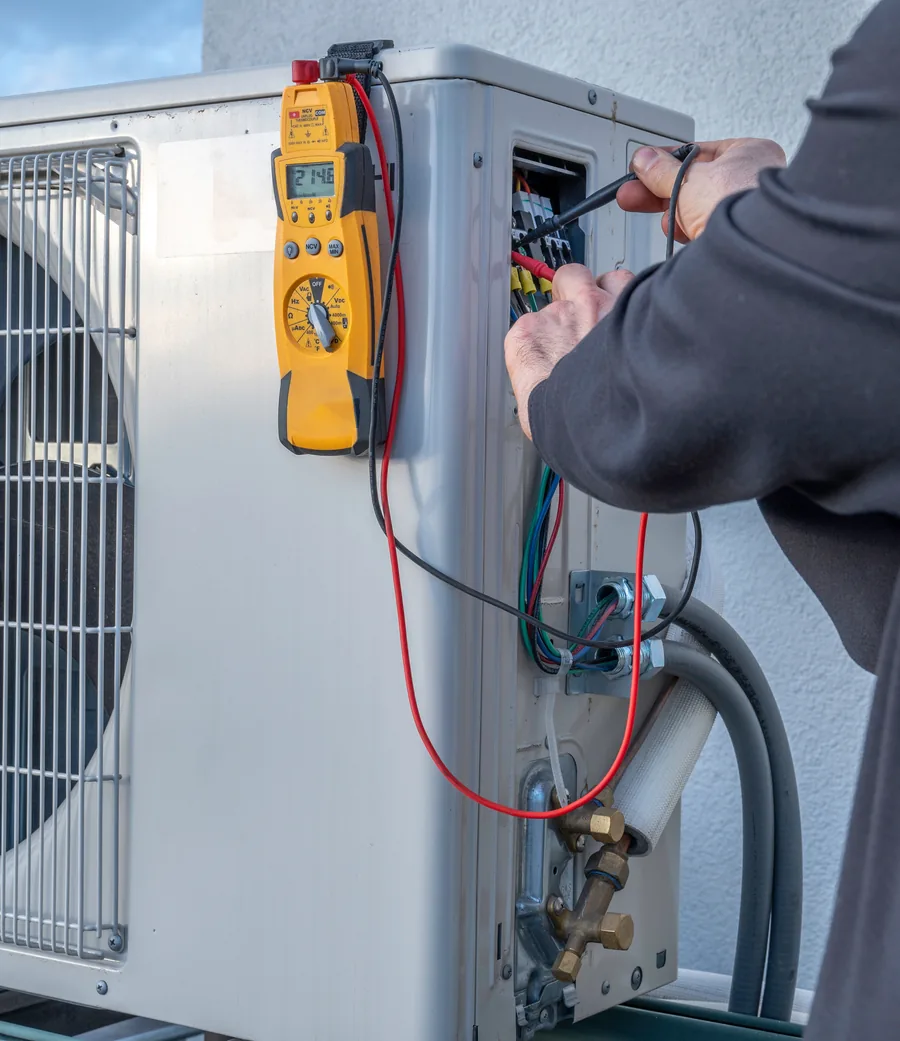 Manifold gauges connected to a ductless mini-split condenser