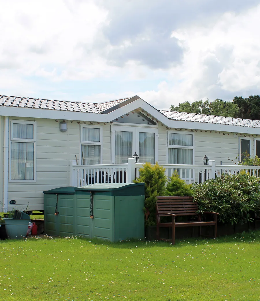 Manufactured home with a landscaped lawn