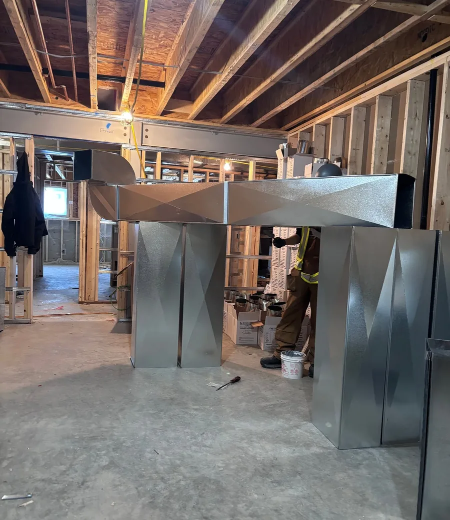New ductwork and plenum installed in an unfinished basement