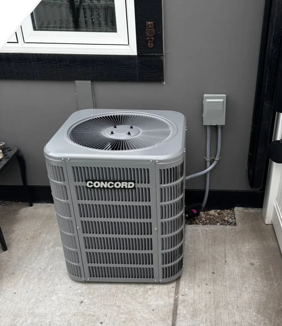 Concord central air conditioning unit installed beside a Saskatoon home