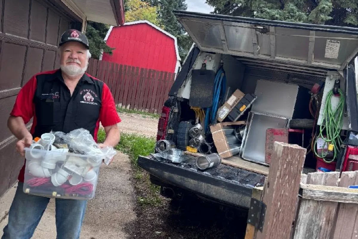 An Aviation Mechanical team member at a rural property outside Saskatoon