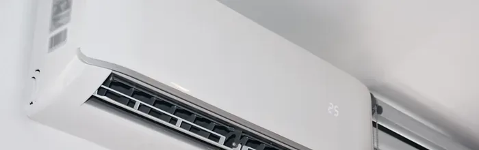 Wall-mounted ductless mini-split indoor head in a finished room